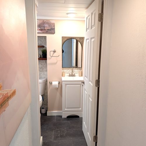 BATHROOM #2 (LOWER LEVEL):  Full bathroom on the lower level.  Just like the main floor bathroom, it features a relaxing rain shower!
