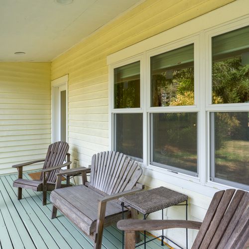 Relax in Adirondack seating on the covered front porch—perfect for sipping your morning coffee, reading a book, or unwinding after a day of exploring Orcas Island.