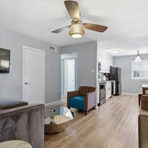 Light-filled living room w/ a welcoming entryway that sets the tone.