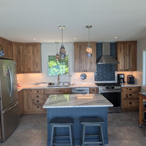KITCHEN (SECOND FLOOR):  The home has a full kitchen with a kitchen island and all appliances, including a dishwasher.  There is also a great view of Crystal Lake from the ktichen!
