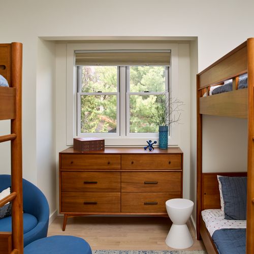 The second bedroom in the guest house features two bunk beds, perfect for kids.