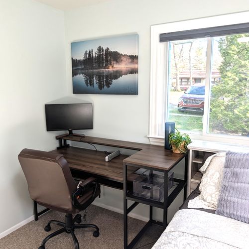 BEDROOM #2 (MAIN FLOOR):  Features a queen-size bed, private desk and chair, and a closet.