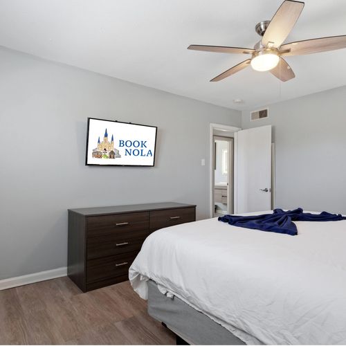 Cozy king bedroom w/ a smart TV for winding down in style.
