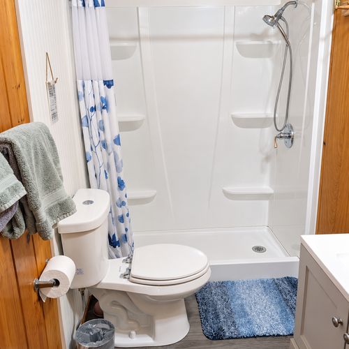 BATHROOM:  The home has a full-size bathroom with a walk-in shower.