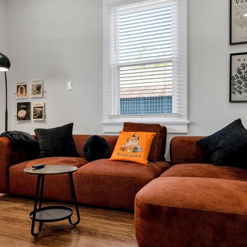 Gather on the oversized sectional by the window for a cozy movie night in