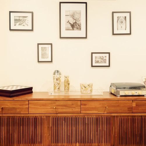 Living area includes a record player with vinyl collection and Marshall speaker.
