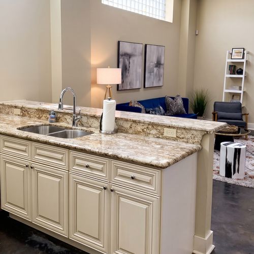 Well-equipped kitchen with granite countertops and modern appliances