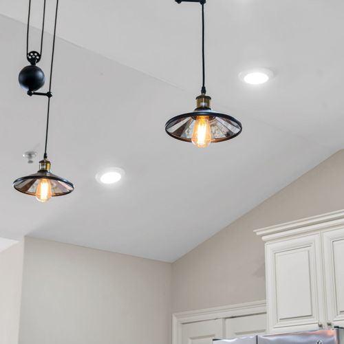 Industrial pendants under soaring ceilings