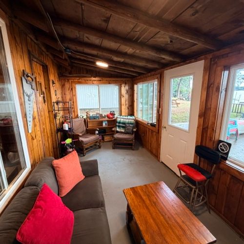 OVERVIEW:  The very fun and family-friendly sunroom with a great view of Van Etten Lake.