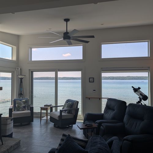 LIVING ROOM (THIRD FLOOR):  Large and luxurios top floor living room with incredible views of Crystal Lake!  (Note that the fireplace is not available for guest usage.)