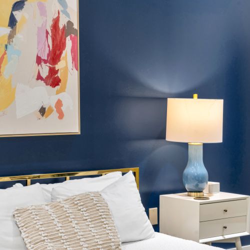 Blue ceramic lamp on a modern nightstand