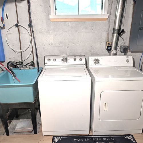 LAUNDRY ROOM (LOWER LEVEL):  Very convenient laundry room with a washer, dryer, and laundry sink.