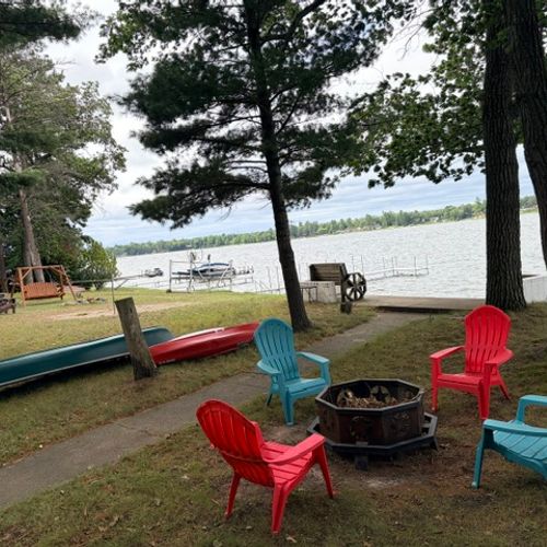 OVERVIEW:  The backyard, showing the lakefront, bonfire ring, the canoe, and the kayak.