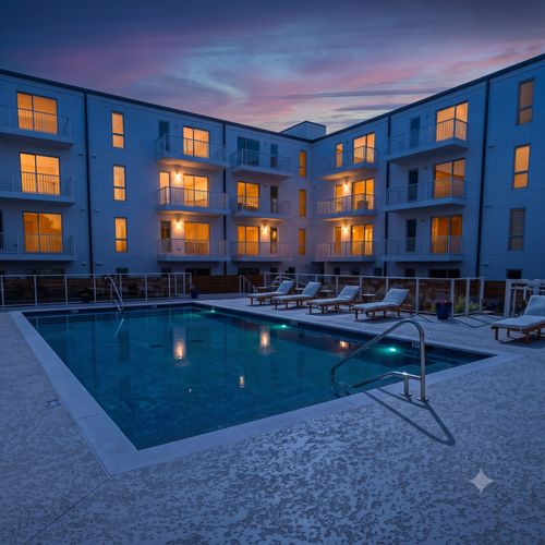 Lounge poolside at the resort-style pool — your own summer escape just steps away.