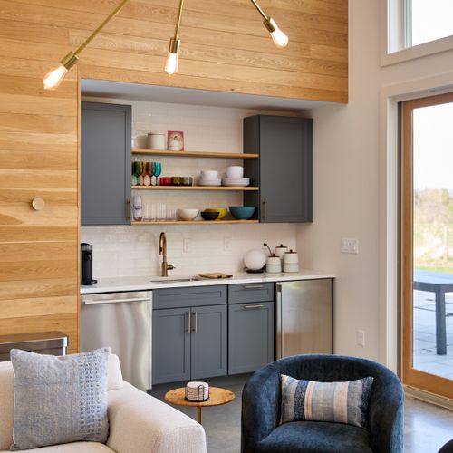 A kitchenette in the pool house allows seamless entertaining on the patio.