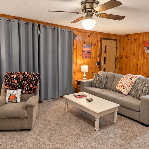 OVERVIEW:  The home has a comfy and relaxing living room with a sofa, chair coffee table, and television.  (Note that the wood fireplace in the living room is not available for guest usage.)