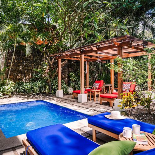 Tropical pool and bungalow at this Langosta vacation rental near Tamarindo. Morning yoga by the water, arrange fishing charters and eco tours, then unwind in paradise. Perfect home base for active travelers seeking adventure and tranquility.