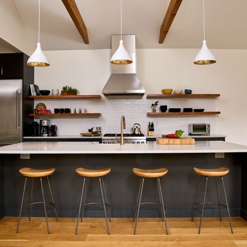 Oversized island with counter seating in the main house kitchen.