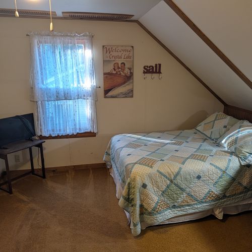 LOFT (SECOND FLOOR):  The home has a large upstairs open loft area that includes 3 full-size beds and a twin bed, thus sleeping up to 7 people in the loft area.