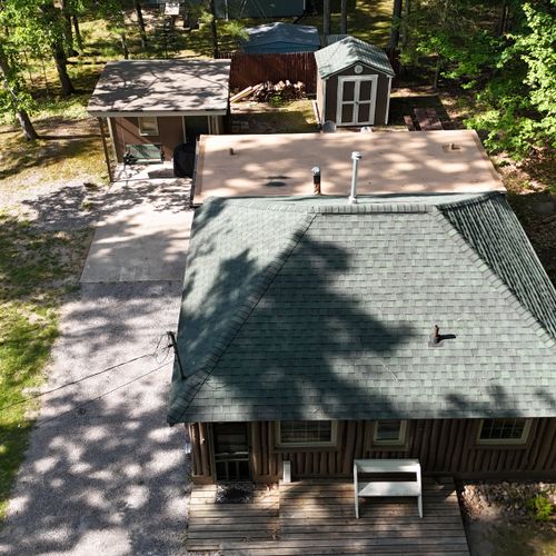 EXTERIOR:  Aerial photo from above the cabin.