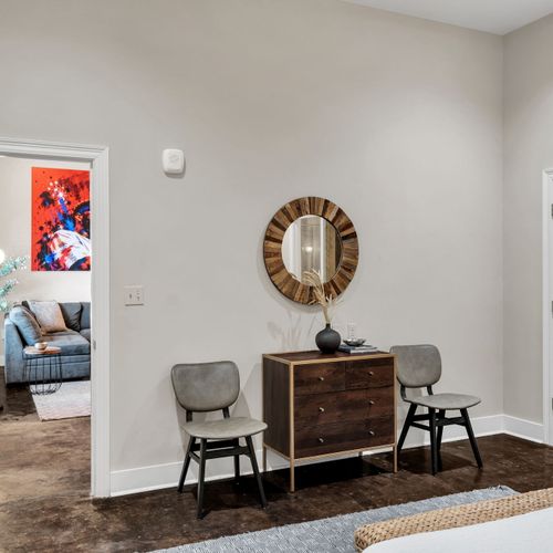Sitting nook with a statement wood mirror