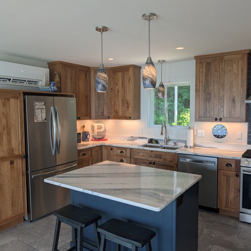KITCHEN (SECOND FLOOR):  The home has a full kitchen with a kitchen island and all appliances, including a dishwasher.  There is also a great view of Crystal Lake from the ktichen!