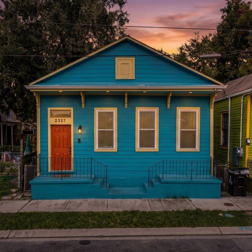 Charming turquoise exterior that's as welcoming as the inside.