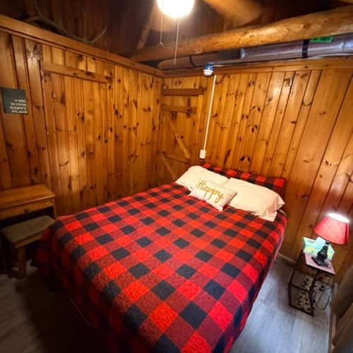 BEDROOM #2:  Features a queen-size bed, dresser, and a nightstand.