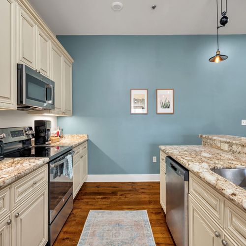 Sky blue kitchen wall with framed accents