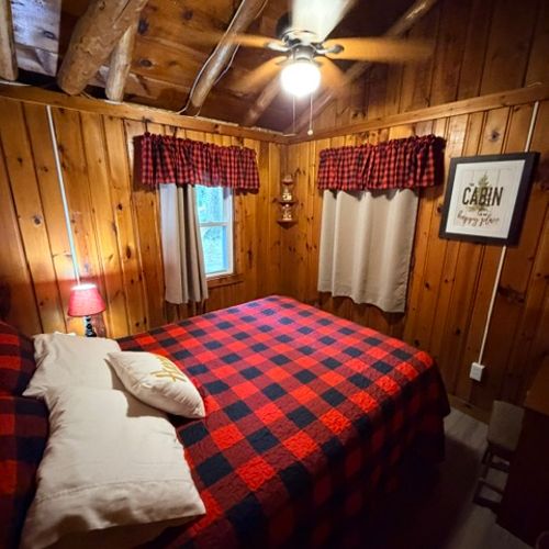 BEDROOM #2:  Features a queen-size bed, dresser, and a nightstand.