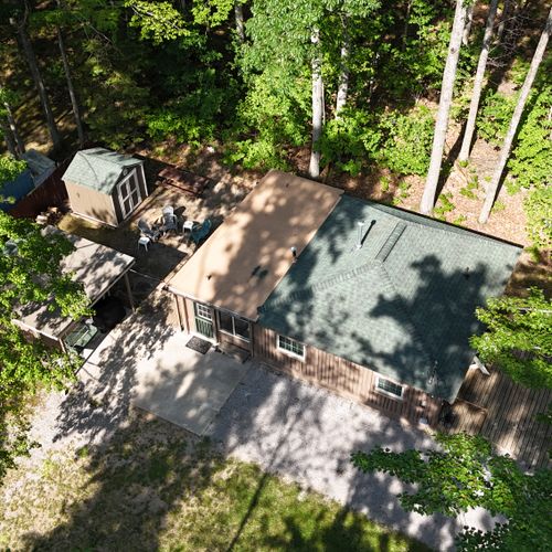 EXTERIOR:  Aerial photo from above the cabin.