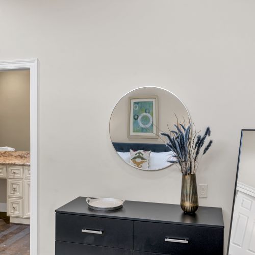 Round mirror and dried florals for a boho touch