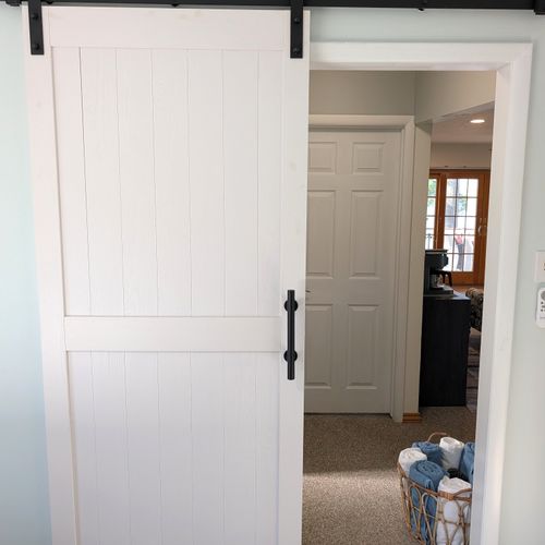 BEDROOM #2 (MAIN FLOOR):  Features a queen-size bed, private desk and chair, and a closet.