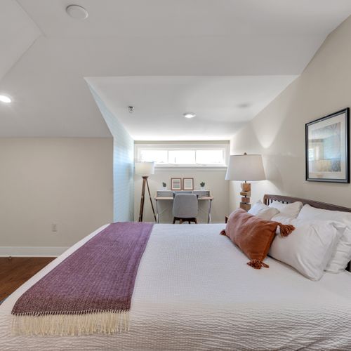 King bed with a peaceful window view