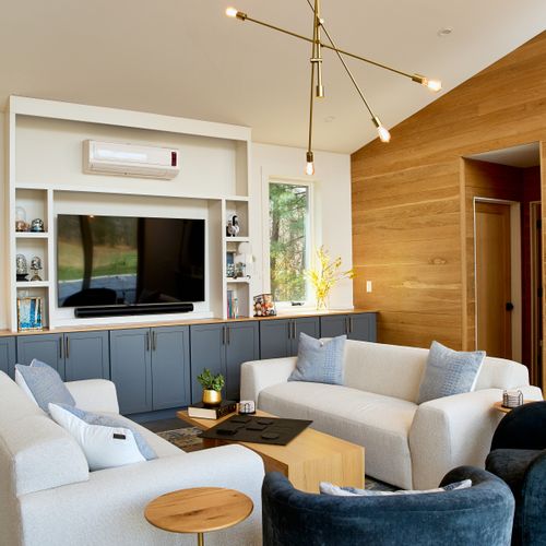 Looking into the pool house living room, with entry to another full bathroom just beyond.