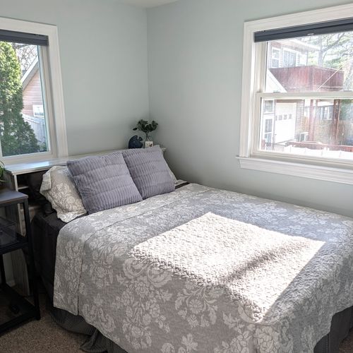BEDROOM #2 (MAIN FLOOR):  Features a queen-size bed, private desk and chair, and a closet.