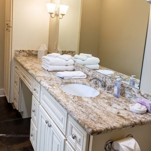 Bright bathroom nook w/ granite counter & vessel sink
