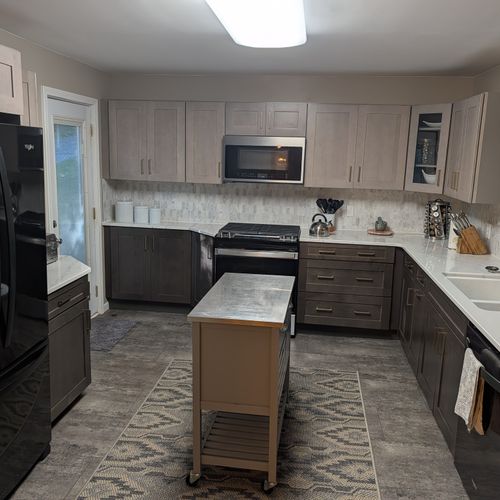 KITCHEN (SECOND FLOOR):  Large modern kitchen with a portal island and all appliances including a dishwasher and microwave.