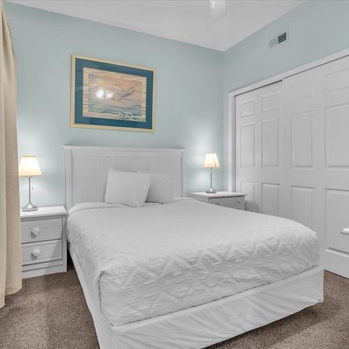 First level bedroom with a queen bed