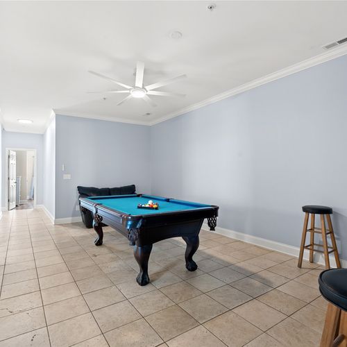 Spacious game room area with full size pool table