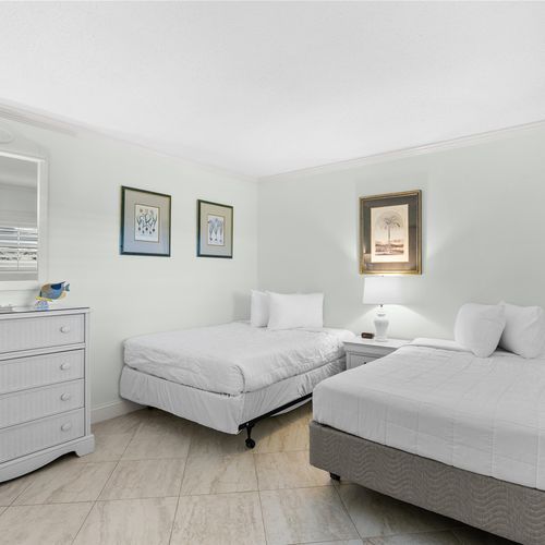 Second Bedroom with 2 Double Beds and Dresser