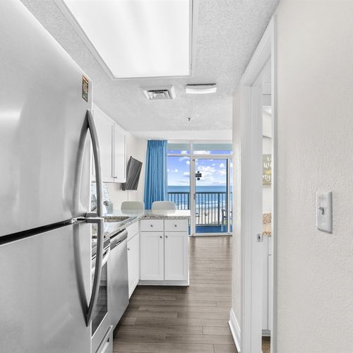 Large Refrigerator and kitchen area