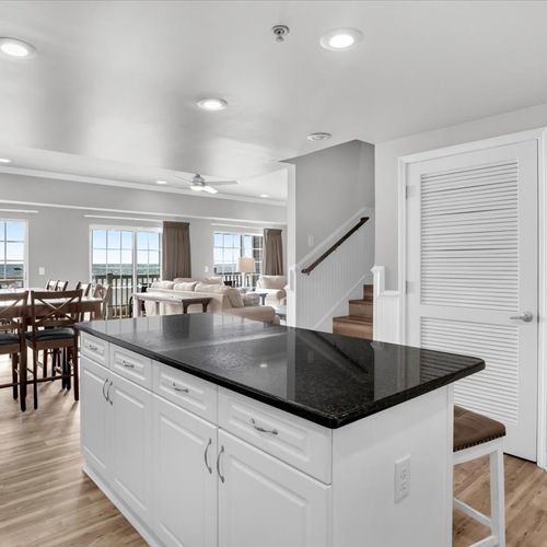 View from kitchen into dining area with oceanfront view