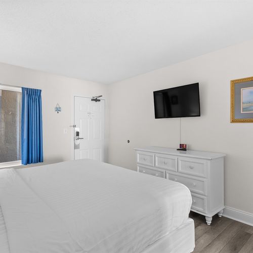 King bed with smart TV and dresser