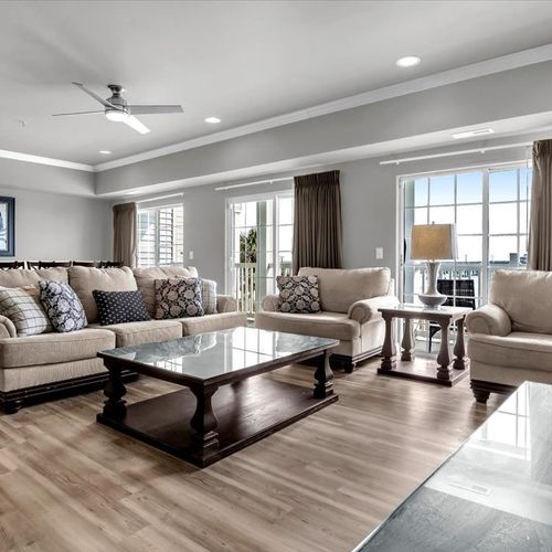 Living room with view of dining area and Oceanfront view