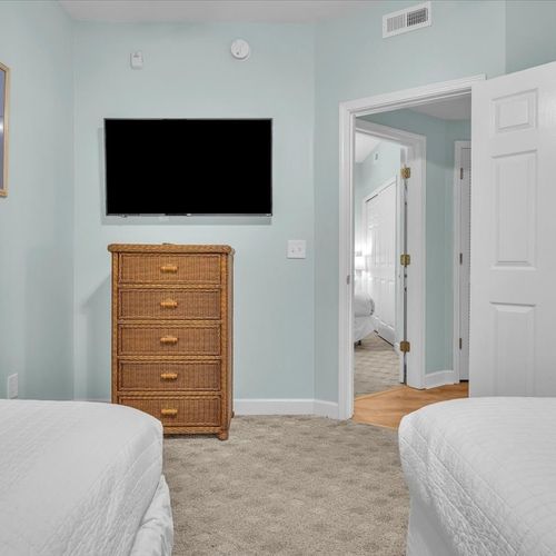 Twin beds with smart tv in the room