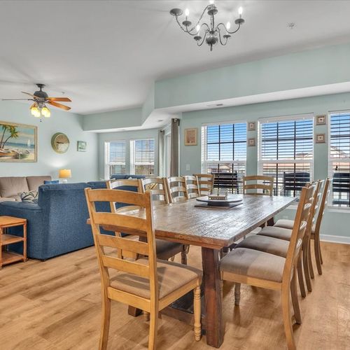 View from kitchen into living room with balcony view