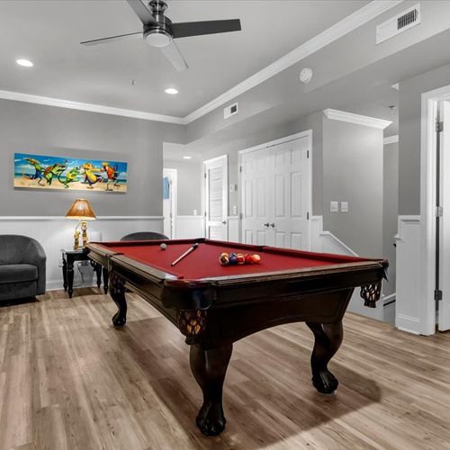 Game room with pool table, seating and smart tv