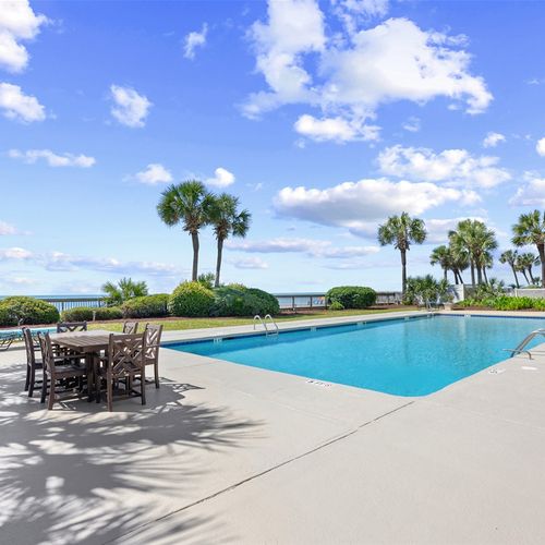 Outdoor Pool with Outside Seating and Lounge Chairs