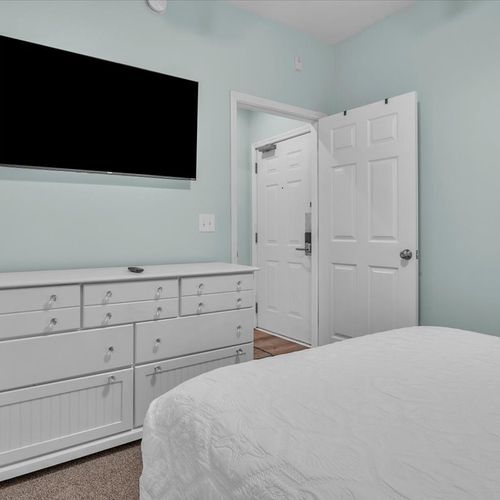 Room with smart tv and dresser